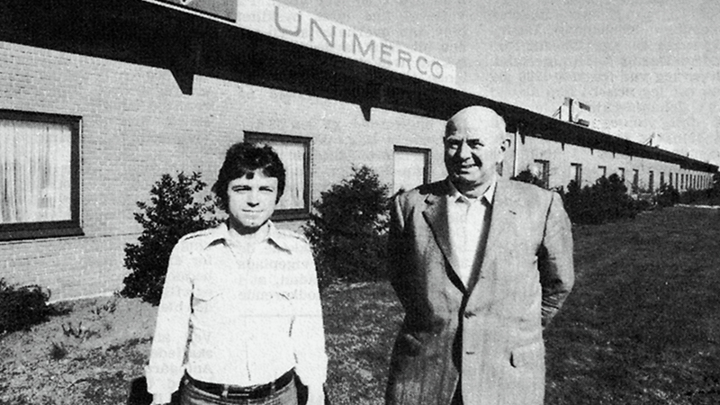 Two former CEOs Kenneth Iversen and Hans Foxby standing in front of the Unimerco building in Sunds in 1976