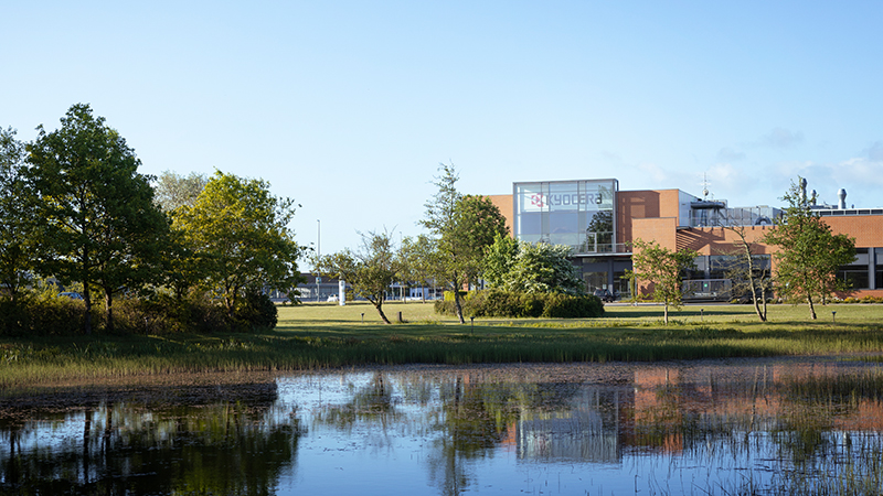 A look at the Kyocera Unimerco building in Sunds seen from the outside nearby a lake close to the company.