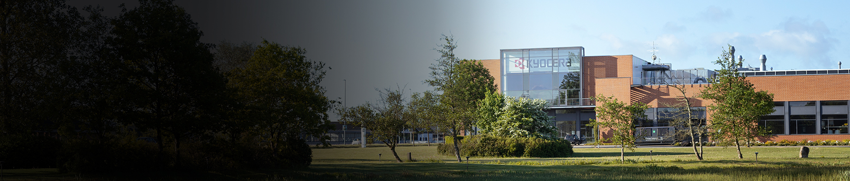 The Kyocera Unimerco building in Sunds nearby a lake seen from outside