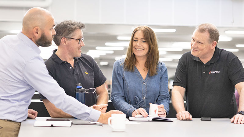 4 colleagues having a meeting in the office